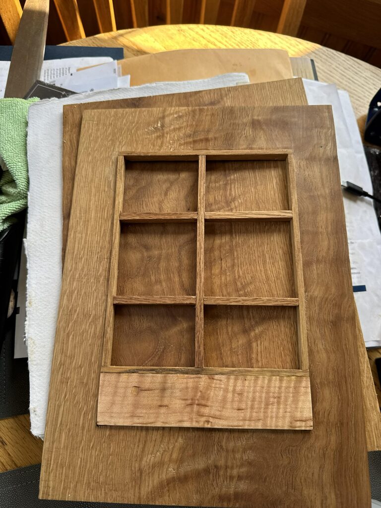 Close-grained oak book cover with a miniature shoji-like wooden window frame